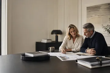 Married couple reviewing estate-planning documents representing South Dakota spousal trust planning